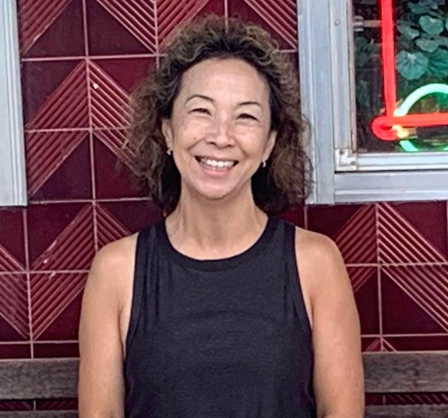 Kazumi Smith, group fitness and personal training coach at Sweat Is Free