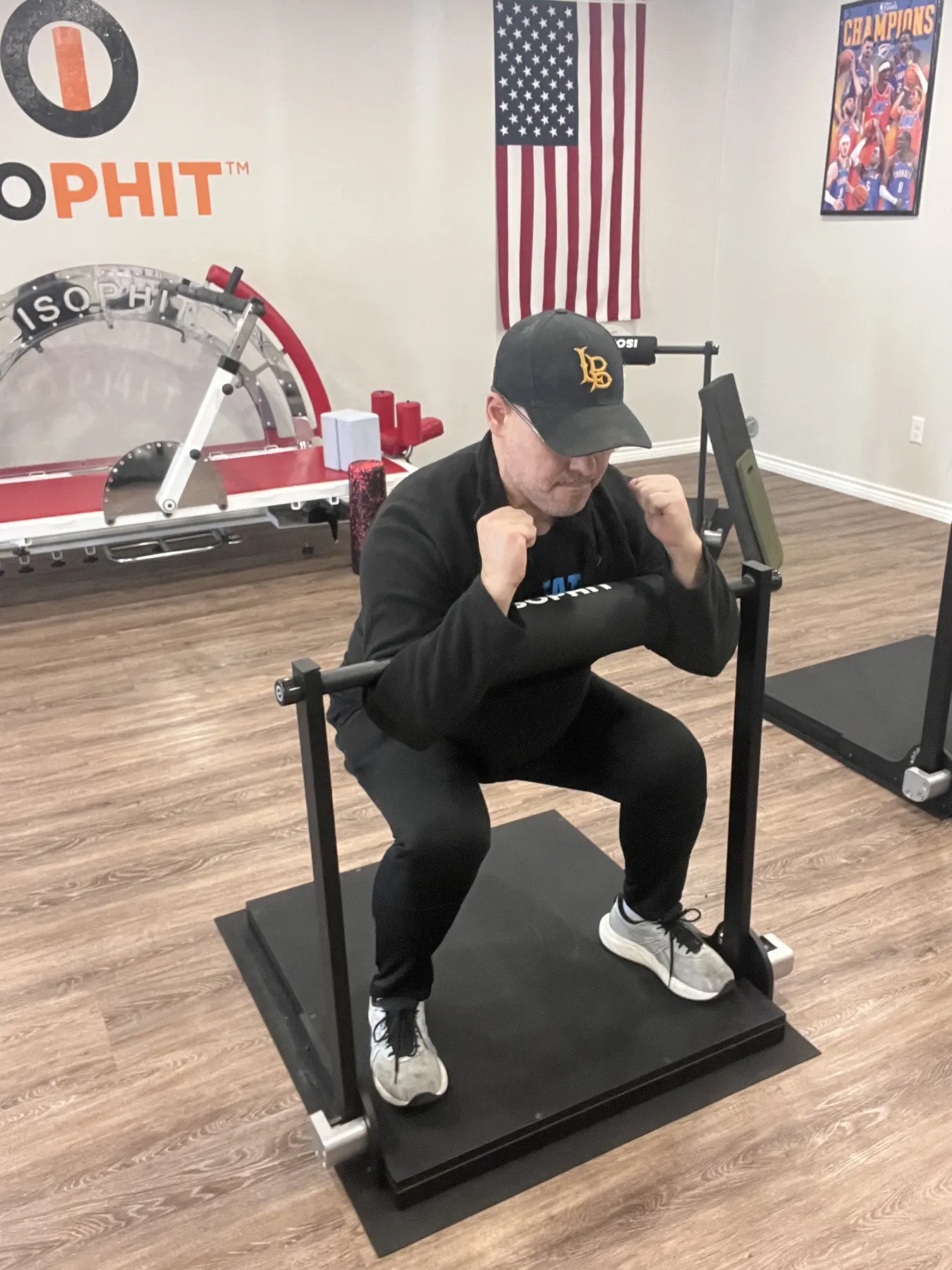 Adult member performing an individualized isometric squat exercise